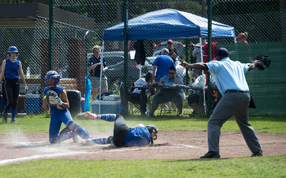 Hohenfels' Isabella Williams, right, slides in safe at home ahead of a tag by Sigonella's Averi Chandler during the DODEA-Europe Division II/III softball championship at Ramstein Air Base, Germany, on Saturday, May 26, 2018.
