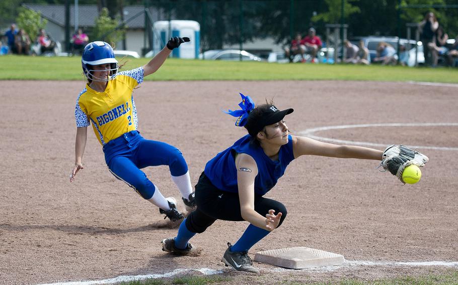 Sigonella's Martina Raco, left, dives for third as Hohenfels' Alexus Garcia reaches for a throw during the DODEA-Europe Division II/III softball championship at Ramstein Air Base, Germany, on Saturday, May 26, 2018.
