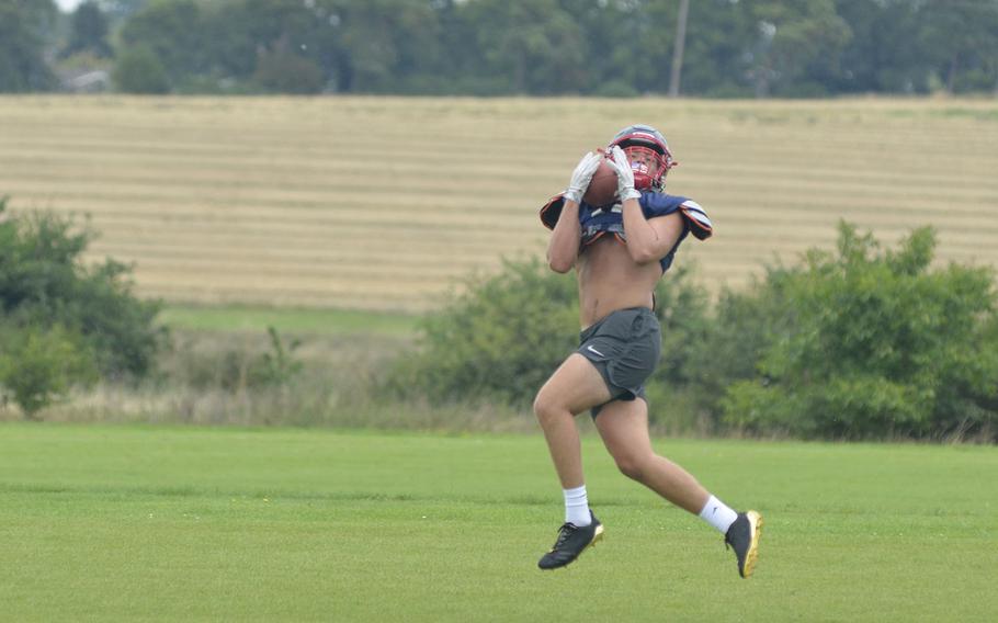 Returning starter Manny Cordero catches a pass during Lancer football preseason practice at RAF Lakenheath, England, Tuesday, Aug. 14, 2018. Cordero is expected to play multiple positions on offense, defense and special teams this season.