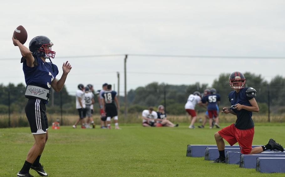 Rookie quarterback Anthony Smout runs a bootleg drill during Lancer football preseason practice at RAF Lakenheath, England, Tuesday, Aug. 14, 2018. 