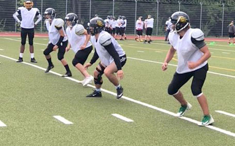 Stuttgart linebackers Gabe Flyte, Will Suddeth, Tyler McGrady, Garrett Sheffield and Cam Bochannek run drills at a recent Panther football practice. The Panthers are looking to be the first program to repeat as Division I football champion in more than a decade. 