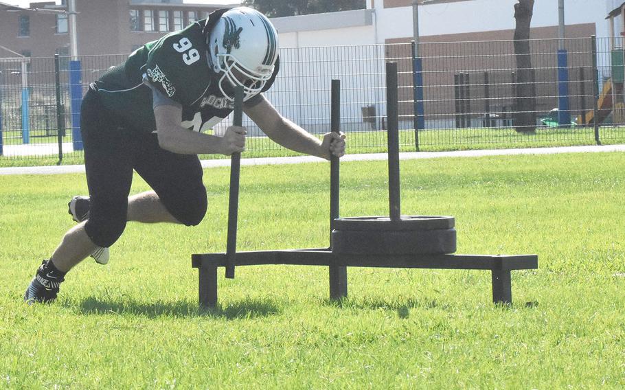 The Naples Wildcats pushed a weighted sled as part of power training on Tuesday, Aug. 28 at Naples Middle High School. Coaches see promising signs in the team, which features a mixture of new and returning players. 