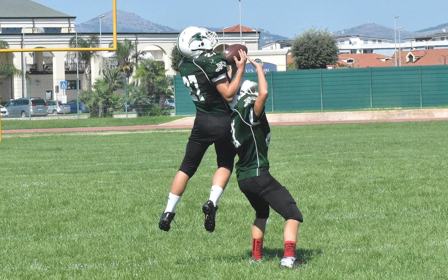 The Wildcats practice passing defense in the hot August sun. Their first game will be at home on Sept. 8 against SHAPE. 