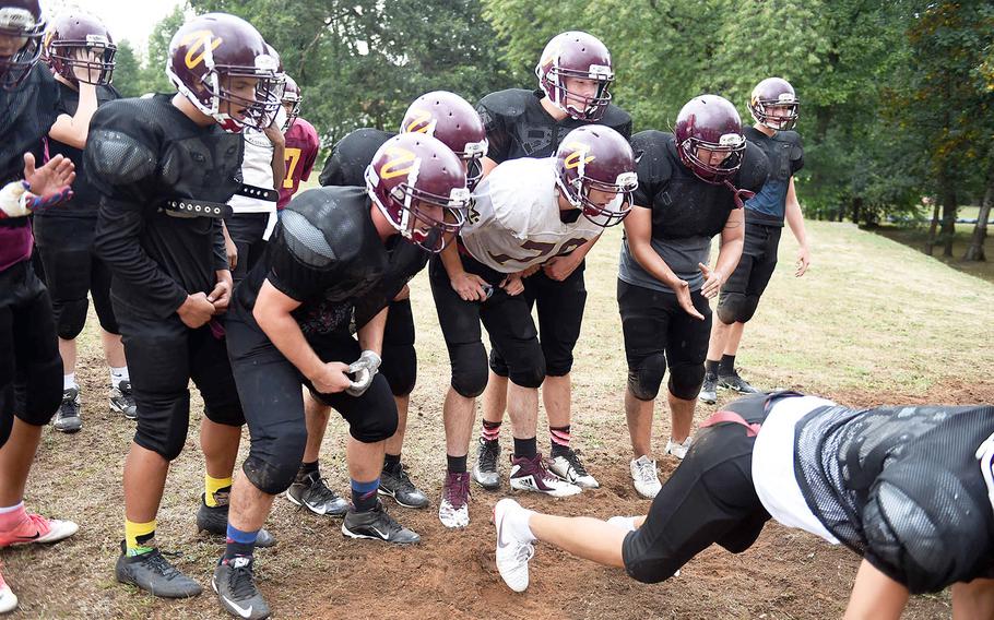 The Vilseck Falcons motivate each other during practice, Friday, Aug. 31, 2018, at Vilseck, Germany.