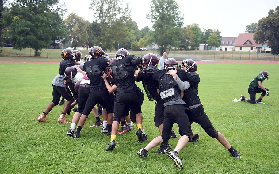 The Vilseck Falcons' offensive and deffensive lines clash during practice, Friday, Aug. 31, 2018, at Vilseck, Germany.
