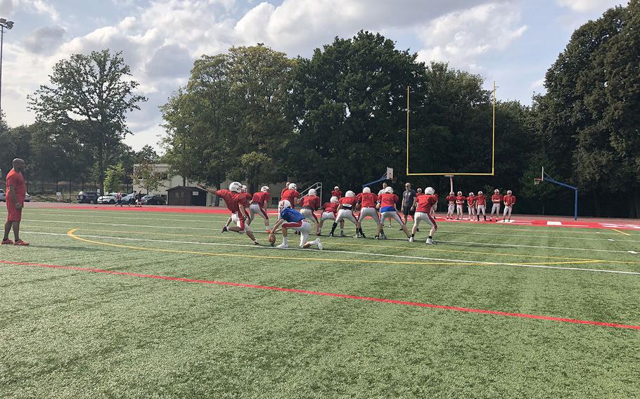 International School of Brussels players execute a kicking drill at a recent preseason practice. The Raiders are among seven teams in the mix for one of two DODEA-Europe Division II playoffs spots. 