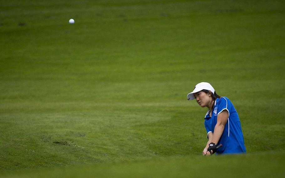 Ramstein's Phoebe Shin chips the ball during the DODEA-Europe golf championship at Rheinblick golf course in Wiesbaden, Germany, on Friday, Oct. 13, 2017.