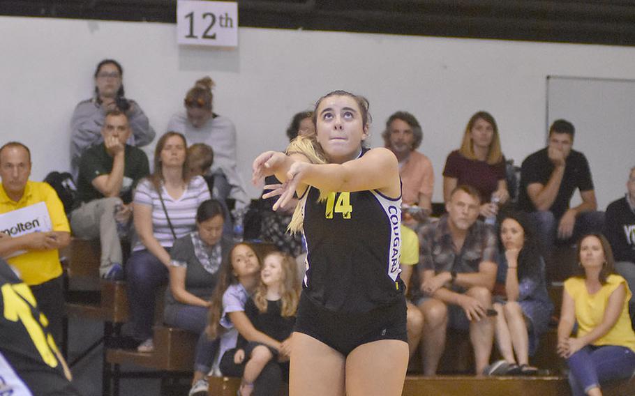 Vicenza's Julia Lombardi digs the ball during the Cougars' volleyball matchup with Ramstein on Friday, Sept, 14, 2018.