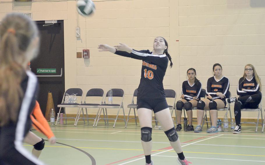 Spangdahlem's Madison Lobre receives a volleyball serve from Alconbury during a high school varsity game at RAF Alconbury, England, Saturday, Sept. 22, 2018. 