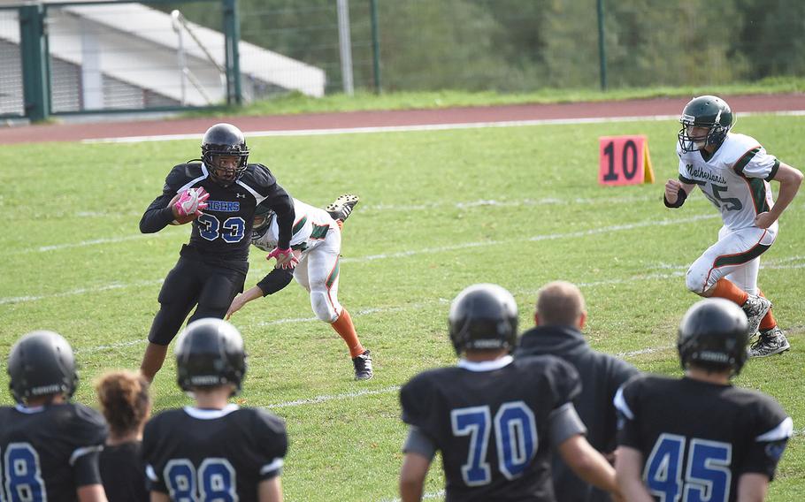 Hohenfels' Julian Walker dodges AFNORTH Lions as he runs the ball for a kick return, during a game at Hohenfels, Germany, Saturday, Sept. 22, 2018. 
