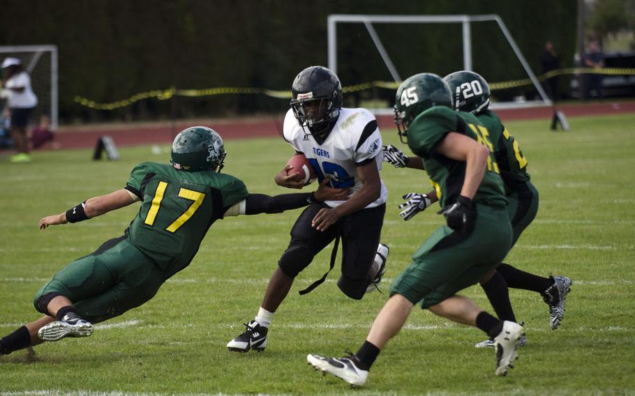 The Alconbury defense converges on a Hohenfels ball carrier in a 2014 DODEA-Europe football game. Alconbury and Sigonella opted not to participate in Division III football in 2018, but are considering it for future seasons.