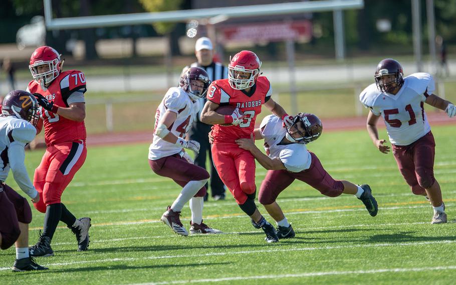 Solo Turgeon breaks a tackle during the Kaiserslautern vs. Vilseck high school football game in Kaiserslautern, Germany, Saturday Sept. 29, 2018.  Kaiserslautern won the game 26-20
