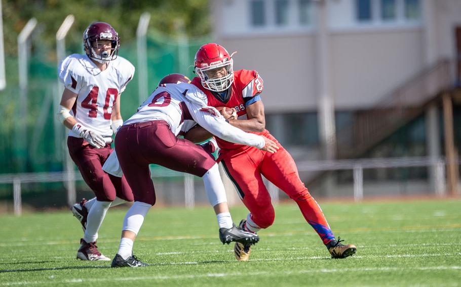 Corey Coombs is hit during the Kaiserslautern vs. Vilseck high school football game in Kaiserslautern, Germany, Saturday Sept. 29, 2018.  Kaiserslautern won the game 26-20
