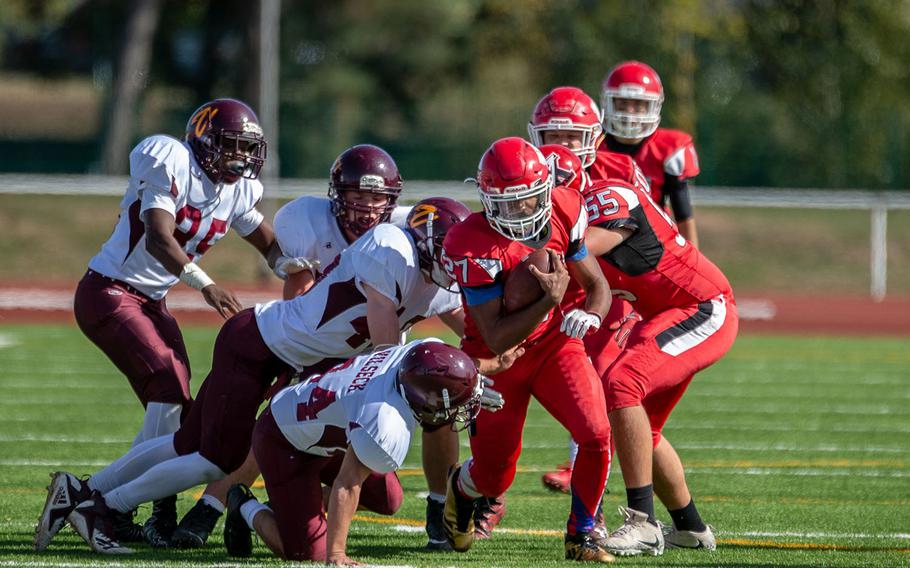 Corey Coombs breaks a tackle during the Kaiserslautern vs. Vilseck high school football game in Kaiserslautern, Germany, Saturday Sept. 29, 2018.  Kaiserslautern won the game 26-20
