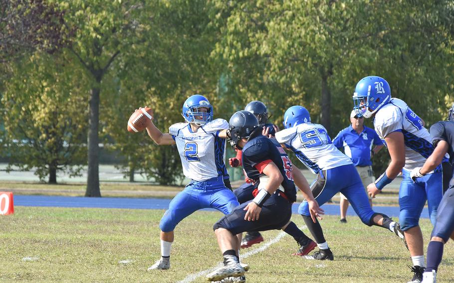 Rota quarterback Wesley Penta braves the Aviano pass rush to attempt to attempt a pass Saturday in the Saints' 22-14 victory.