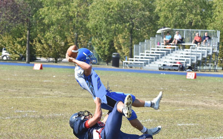 Aviano's Kohl Mattes sacks Rota quarterback Wesley Penta before he gets rid of the ball in the Saints' 22-14 victory on Saturday.