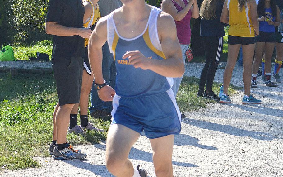 Benjamin Latimer, 15, a sophomore at Sigonella and originally from Jacksonville, Fla., crosses the finish line at a  5-kilometer race that took place at Lago Di Fimon, Vicenza, Italy, on Saturday, Sept. 29. He finished in first with a time of 17 minutes and 47 seconds.