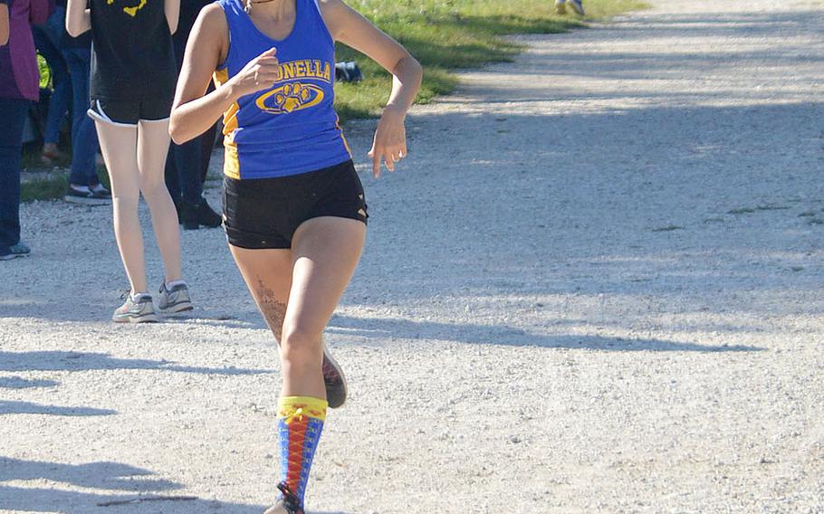 Alexa Patmore from Sigonella crosses the finish line at a 5-kilometer race that took place at Lago Di Fimon, Vicenza, Italy, on Saturday, Sept. 29. She finished in third with a time of 21 minutes and 40 seconds.