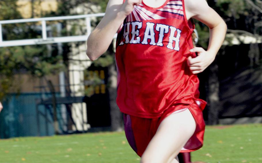 Lakenheath cross country runner Jenna Bills sprints towards the finish line of a 5-kilometer race at RAF Lakenheath, England, Saturday, Oct. 13, 2018. Bills earned third place with a time of 22 minutes and 56 seconds. 