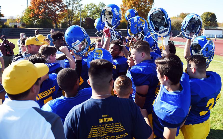 The Ansbach Cougars celebrate after a win against the Brussels Brigands during a game at Ansbach, Germany, Saturday, Oct. 13, 2018.