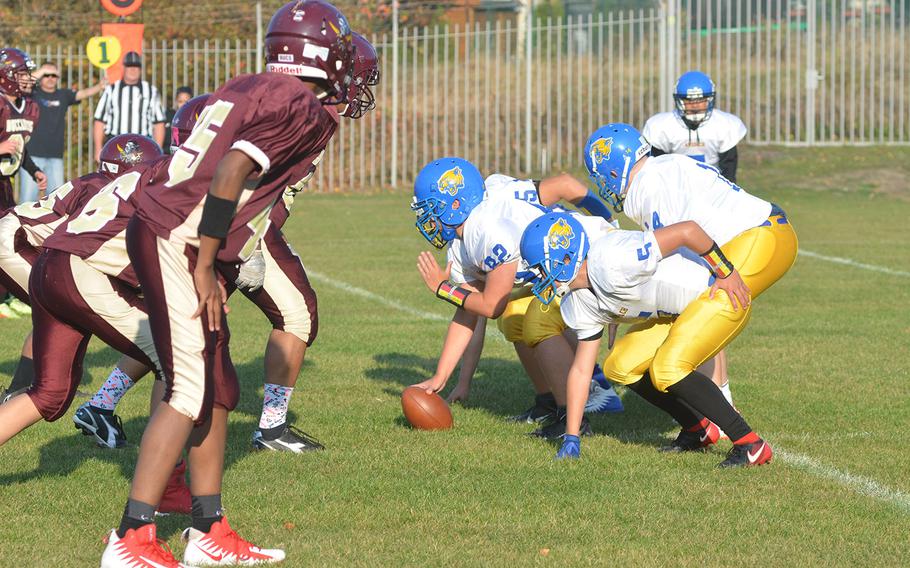 The defensive line of the Baumholder Buccaneers prepares to try to stop the Ansbach Cougars during the Bucs' final game of the season in Baumholder, Germany, Friday, Oct. 19, 2018.
