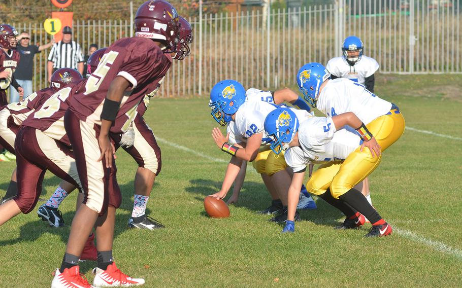 The defensive line of the Baumholder Buccaneers prepares to try to stop the Ansbach Cougars during the Bucs' final game of the season in Baumholder, Germany, Friday, Oct. 19, 2018.
