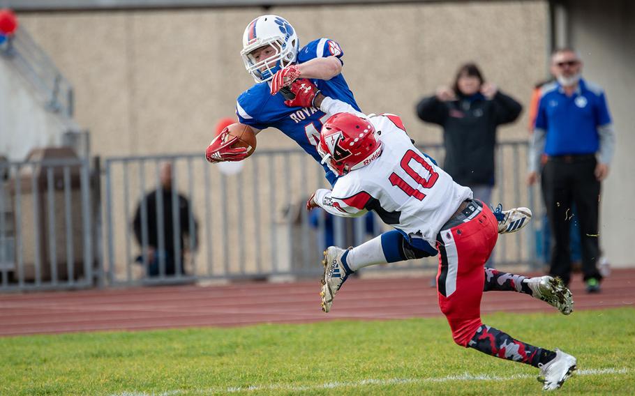 Bailey Holland is forced out of bounds by Cedric Ellis during the Ramstein vs Kaiserslautern football game at Ramstein, Germany, Saturday, Oct. 27, 2018.