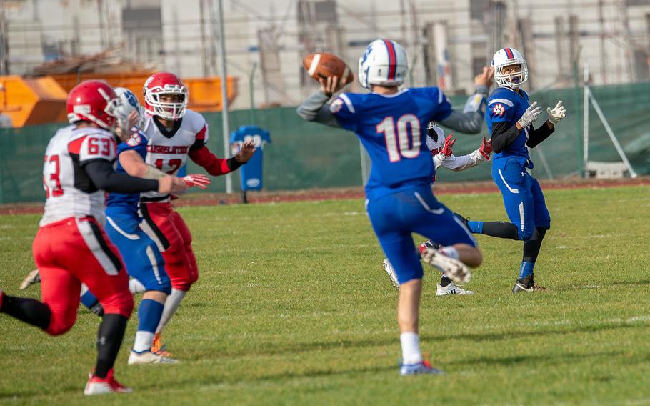 Jason Jones Jr. looks back as Ramstein quarterback Jakob Steinbeck throws down field during a game against Kaiserslautern at Ramstein, Germany, Saturday, Oct. 27, 2018.
