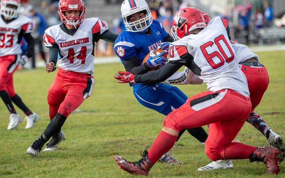 Dominque Arizpe breaks a tackle before scoring during the Ramstein vs Kaiserslautern football game at Ramstein, Germany, Saturday, Oct. 27, 2018.
