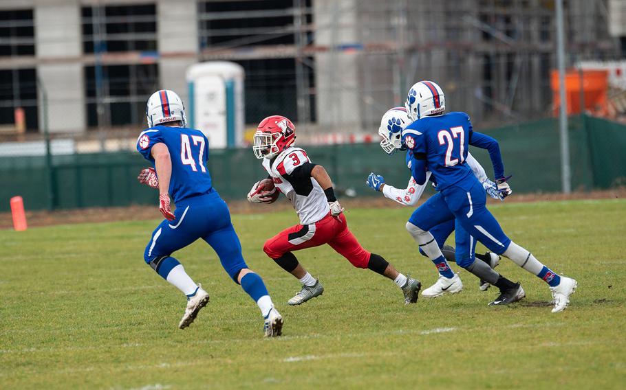 Solo Turgeon tried to avoid tacklers during the Ramstein vs Kaiserslautern football game at Ramstein, Germany, Saturday, Oct. 27, 2018.
