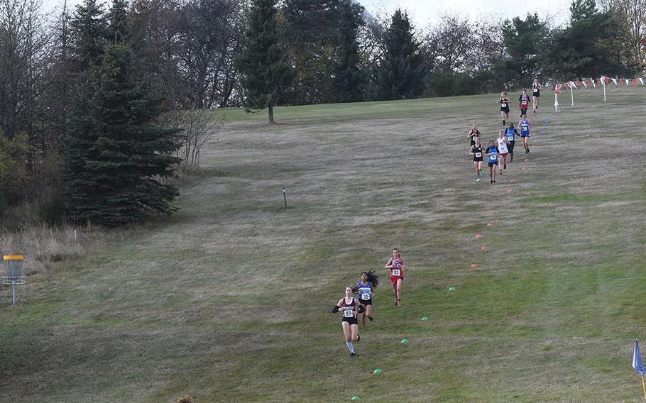 Runners spread out on a downhill during the 2018 DODEA-Europe cross country championship girls' race on Saturday, Oct. 27, 2018, at Baumholder, Germany.
