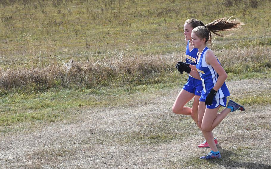 Wiesbaden's Kaitlyn Taylor, left, and Greta Lambert finished in the top 10 to help lead the Warriors to a second-place team finish in the Division I girls' standings at the 2018 DODEA-Europe cross country championships on Saturday, Oct. 27, 2018, at Baumholder, Germany.
