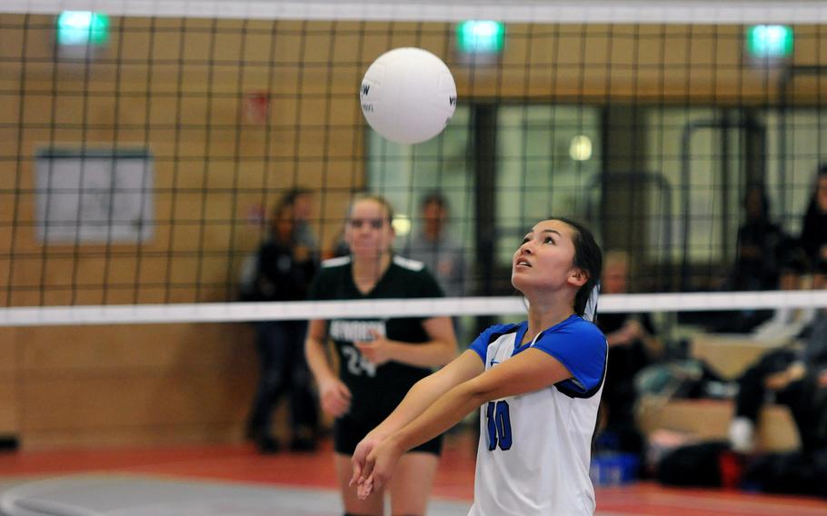 Rota's Avery Nance keeps her eyes on the ball as AFNORTH's Josie Bosch watches from across the net in a Division II match at the DODEA-Europe volleyball finals in Kaiserslautern, Germany, Thursday, Nov. 1, 2018. AFNORTH won 25-11, 25-13, 25-12.
