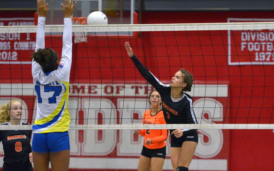 Spandahlem's Koder Teahon hits agains Sigonella's D'Anna Holland in in a Division III semifinal at the DODEA-Europe volleyball finals in Kaiserslautern, Germany, Friday, Nov. 2, 2018. Sigonella advanced to Saturday's final against Brussels with a 25-17, 25-20, 21-25, 25-20 win.