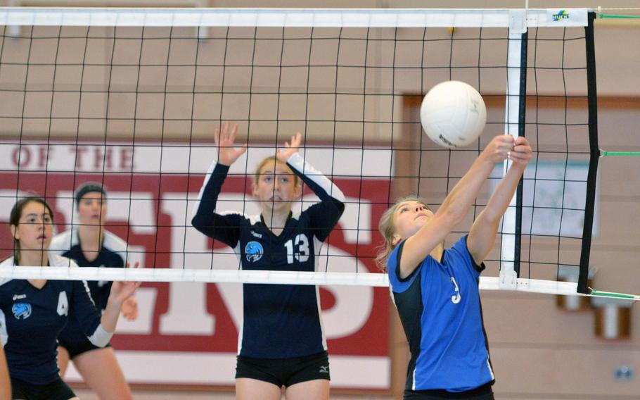 Rota's Nysa Stepp returns a shot as Black Forest Academy's Kennedy Willbanks, left, and Melody Miller defend. BFA beat Rota 25-11, 25-22, 25-16 and will face Marymount in Saturday's final.