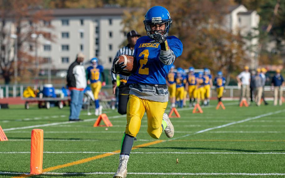 Rovic Denuna from Ansbach crossed the goal line during the DODEA-Europe Division III football championship game between the Ansbach Cougars and AFNORTH Lions, Saturday, Nov. 3, 2018. 
