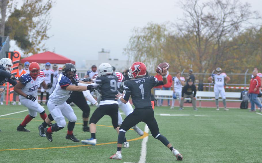 Kaiserslautern's Estaban Saldana attempts to make a pass under pressure during the 2018 European All-Star high school football game in Wiesbaden, Germany.