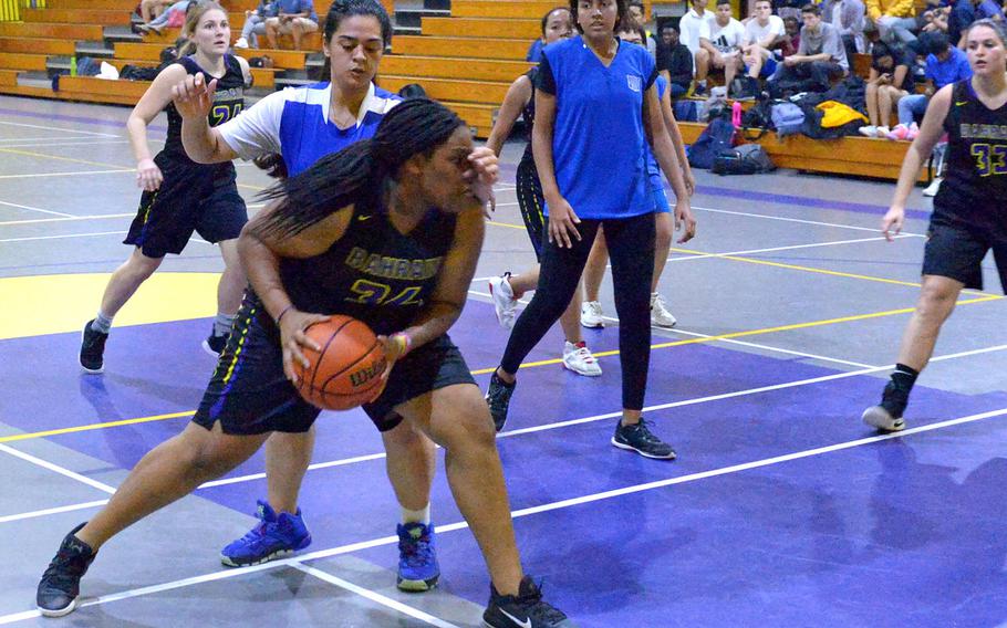 Bahrain's Jayla Dewalt drives for a layup during the Falcons' second game of the season Sunday against the British School of Bahrain. Bahrain won the game 38-8.