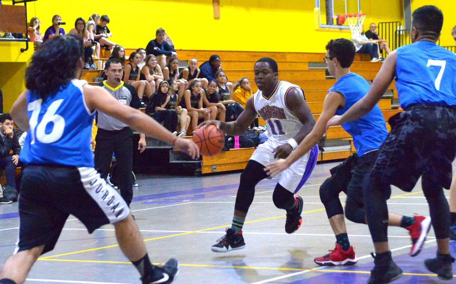Bahrain's Derrick Lee drives for a layup during the school's second game of the season against the British School of Bahrain. The Falcons won the game 34-32.