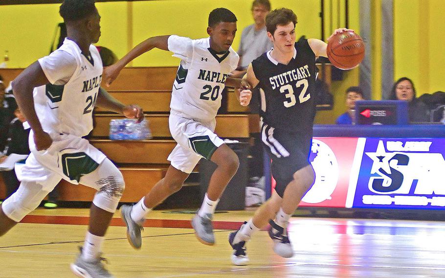Stuttgart's Logan Crouch tries to beat Naples' Biniam Stefanos and Ashton Jeanty, left, down the court in the Wildcats' 46-44 victory in December. DODEA-Europe sports gets underway again this weekend after the Christmas break.