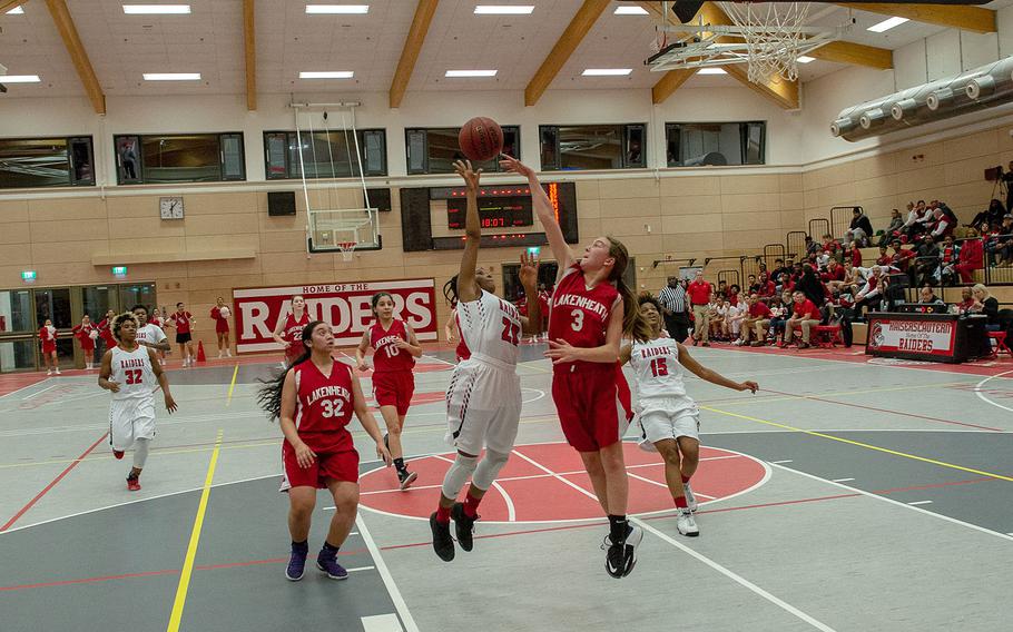 Mikaela Bell has a shot blocked by Catherine Oordt during the Kaiserslautern vs Lakenheath girls basketball game at Kaiserslautern High School, Friday, Jan. 18, 2019.  Kaiserslautern won the game 37-17.