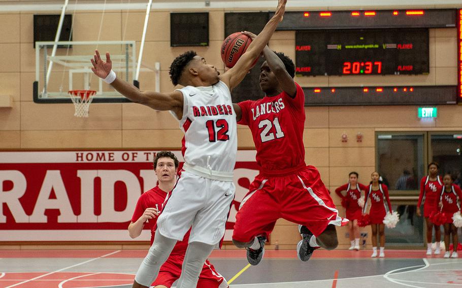 Kyrie Sloan takes the last shot of the game as time runs out during the Kaiserslautern vs Lakenheath boys basketball game at Kaiserslautern High School, Friday, Jan. 18, 2019.  Kaiserslautern won the game 62-59.