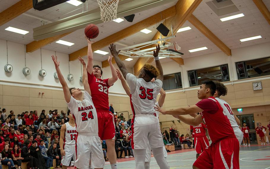 Daniel Oleman takes a shot during the Kaiserslautern vs Lakenheath boys basketball game at Kaiserslautern High School, Friday, Jan. 18, 2019.  Kaiserslautern won the game 62-59.