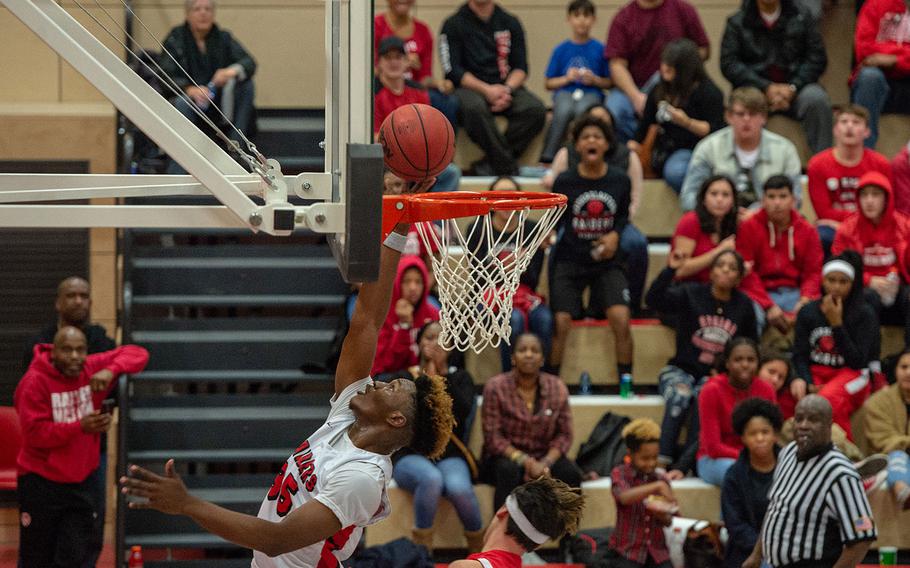 Tre Dotson goes up for a lay-up during the Kaiserslautern vs Lakenheath boys basketball game at Kaiserslautern High School, Friday, Jan. 18, 2019.  Kaiserslautern won the game 62-59.