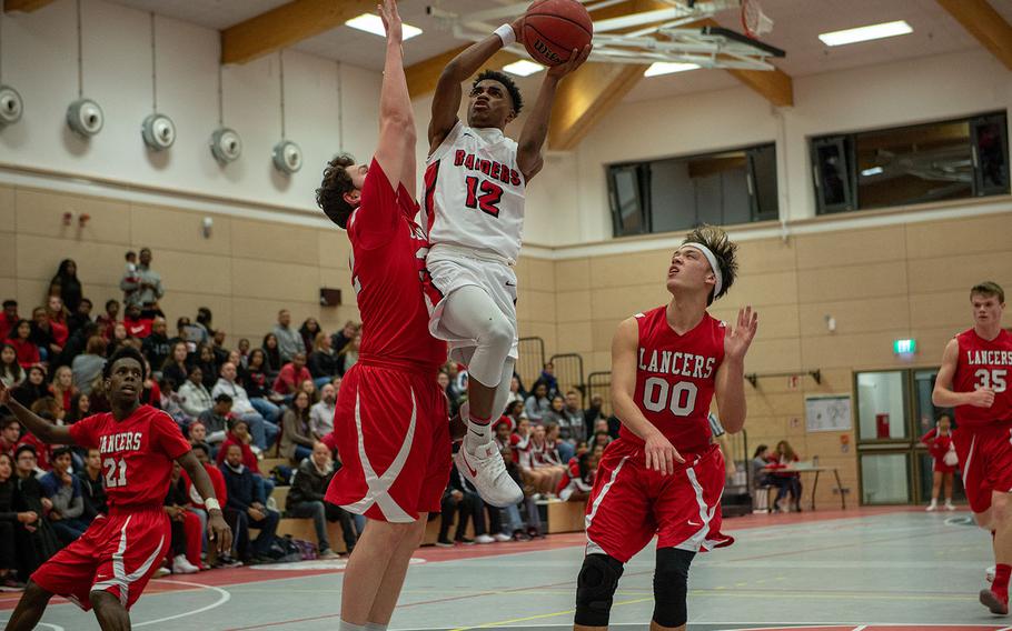 Ervin Johnson goes up for a lay-up during the Kaiserslautern vs Lakenheath boys basketball game at Kaiserslautern High School, Friday, Jan. 18, 2019.  Kaiserslautern won the game 62-59.