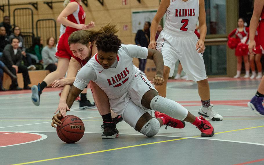 Le'jhanique Brown goes for a lose ball during the Kaiserslautern vs Lakenheath girls basketball game at Kaiserslautern High School, Jan. 18, 2019. Kaiserslautern won the game 37-17.