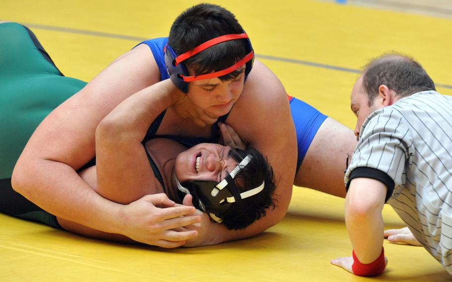 Ramstein's Nick Sherzer pins Naples' Xzavyer Salas in a second-round 285-pound match at the DODEA-Europe wrestling championships in Wiesbaden, Germany, Friday, Feb. 15, 2019. 





