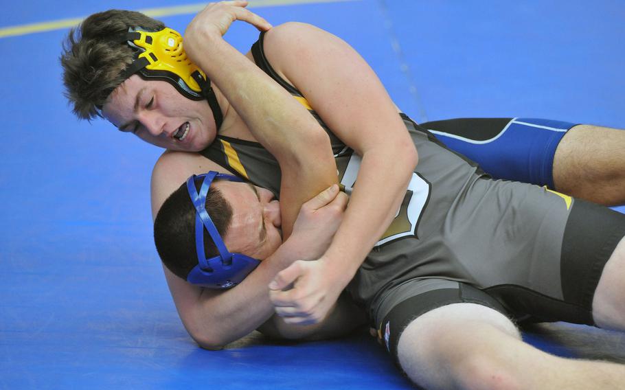 In a 195-pound match at the DODEA-Europe wrestling championships in Wiesbaden, Germany, Friday, Vicenza's Jacob Lorenz goes for a pin against Rota's Gavin Vasquez.






