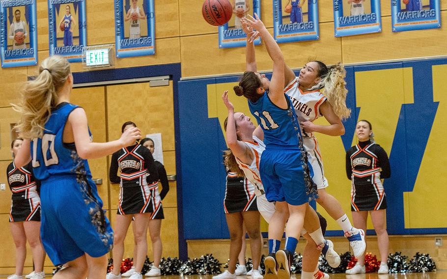 Justine Tila blocks the shot of Hannah Hite during a Division III girls semifinal game between Brussels and Spangdahlem at Wiesbaden High School, Germany, Friday, Feb. 22, 2019. Spangdahlem won the game 46-21. 