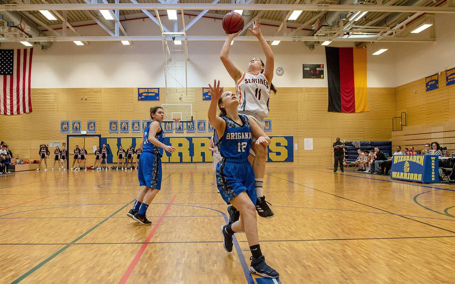 Izzy Smith takes a shot during a Division III semifinal game between Brussels and Spangdahlem at Wiesbaden High School, Germany, Friday, Feb. 22, 2019. Spangdahlem won the game 46-21. 